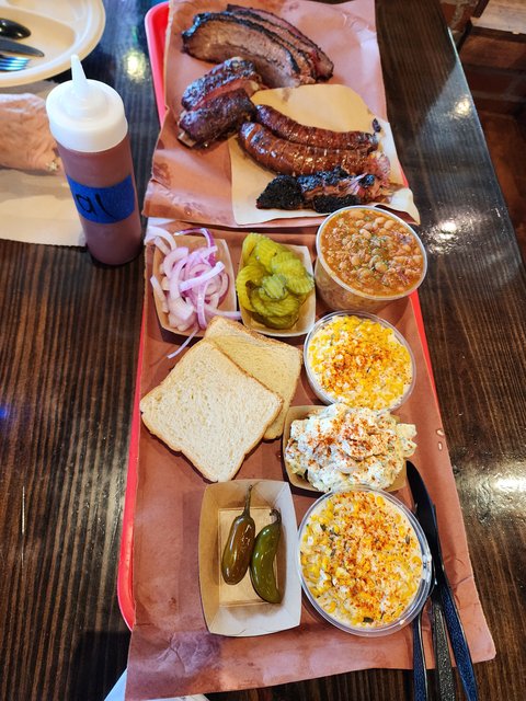 BBQ Meal, Brisket, Sausage, & Ribs. Creamed Corn, Beans & Potato Salad