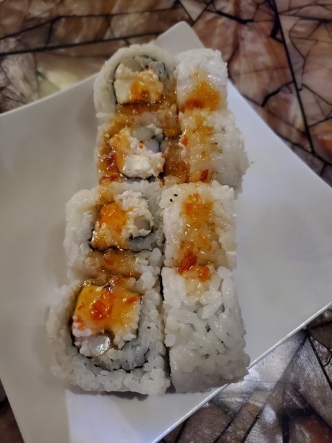 Calamari Roll - Calamari crab mix, topped with sweet chili sauce.