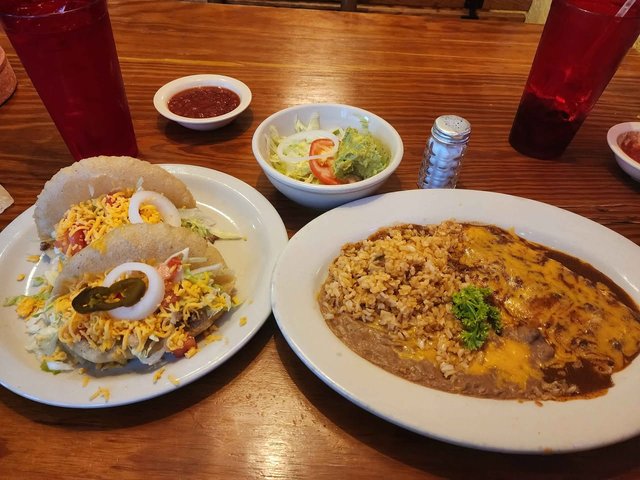 Puffy Taco Platter ($14.50) - 2 Beef Puffy Tacos, 2 Cheese Enchiladas, Chile Con Carne. Rice & Beans, Chips, Salsa, Tortillas, Guacamole & Salad.
