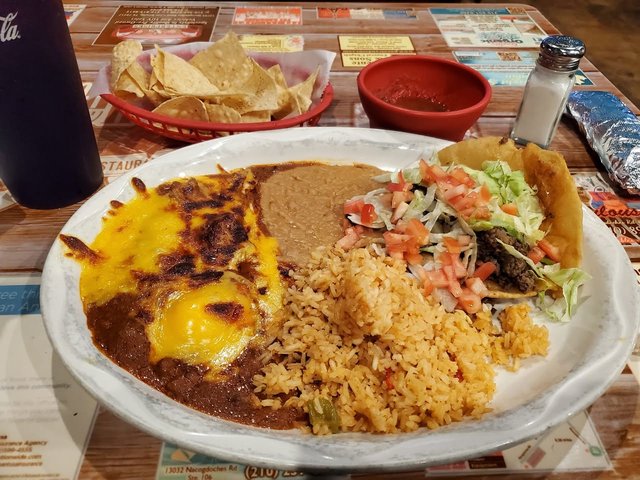 Pancho Villa plate. 2 Enchiladas, Puffy Taco, Rice & Beans.