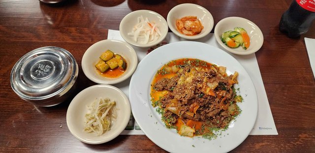 Spicy Beef Bulgogi (Sides Left to Right) Bean Sprouts, Kimchi Cucumber, Pickled Daikon Radish, Kimchi, Cooked Cucumbers (not sure the name)