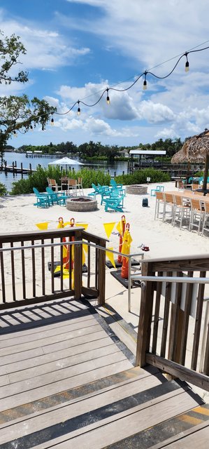 Deck Exit to beach, tiki & waterside beach tables.